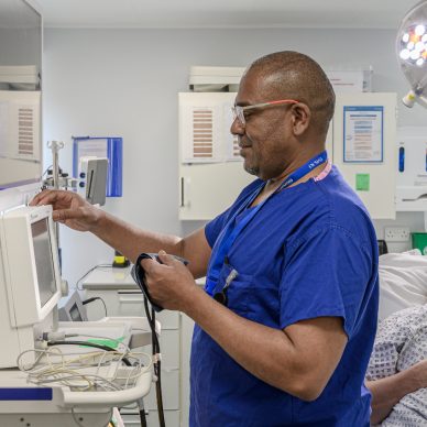 A nurse prepares equipment in the Endocrinology department