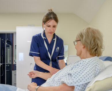 A nurse takes a patient's blood pressure