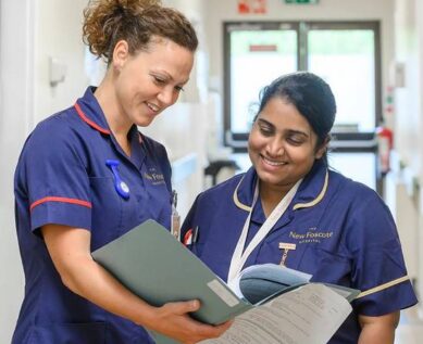 Nurses reading patient file