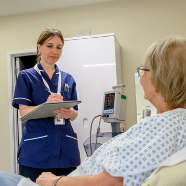 Nurse taking patient notes for Cardiology