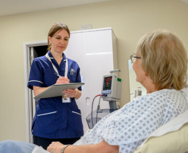Nurse taking patient notes for Cardiology