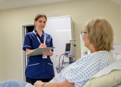 Nurse taking patient notes for Cardiology
