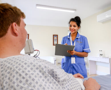 nurse talking to patient