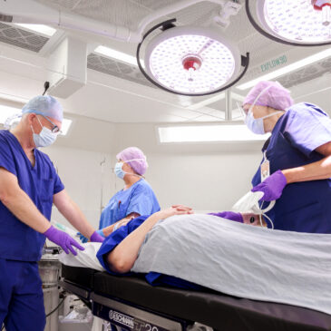 surgeons with patient in New Fostcote Hospital Theatre