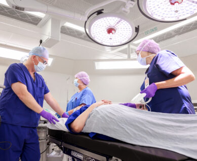 surgeons with patient in New Fostcote Hospital Theatre